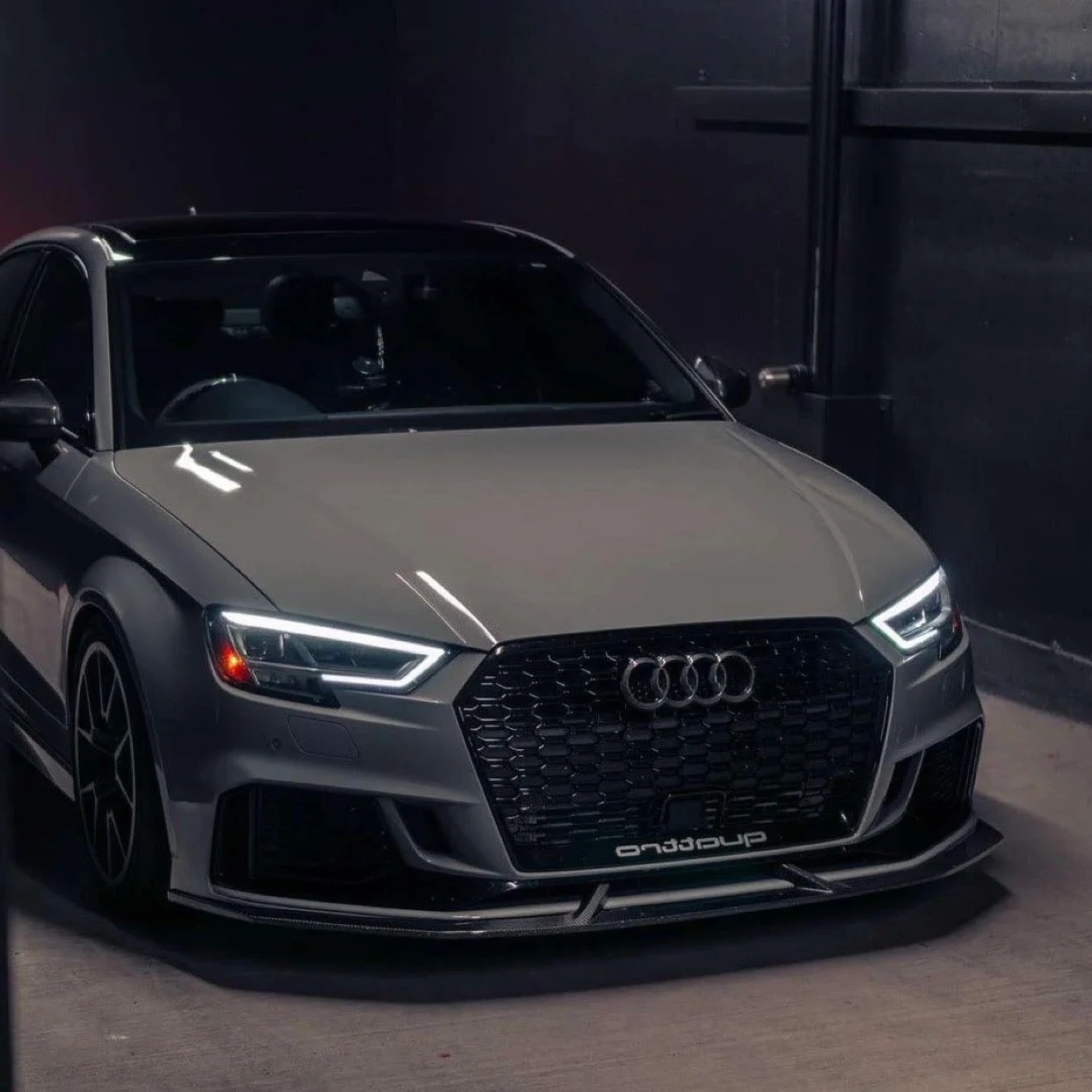 Gray Audi RS3 showcasing professional window tint