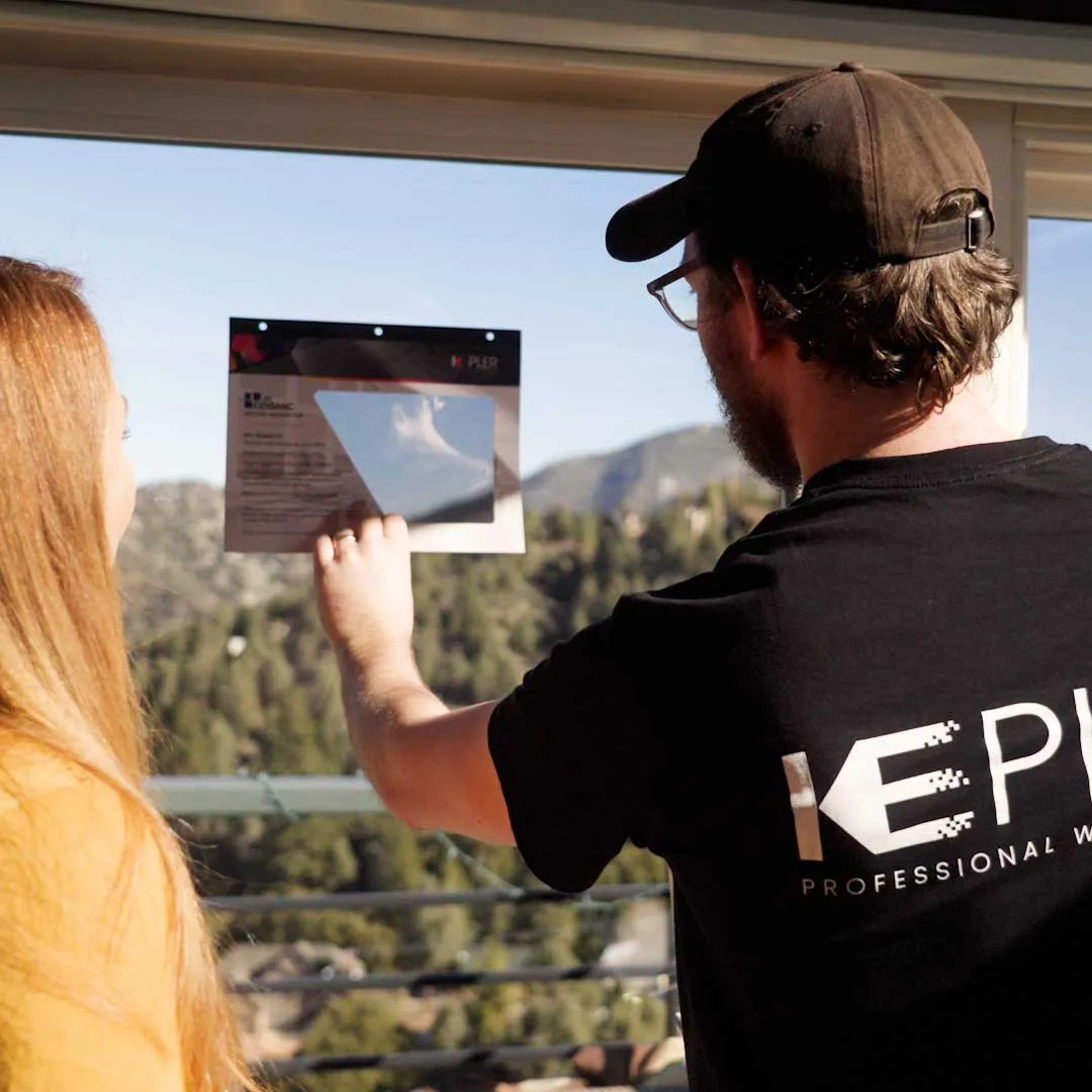Kepler window film sample demonstration during a residential window tint consultation in San Diego