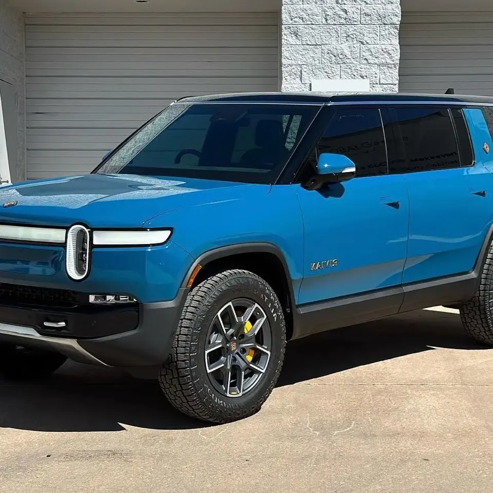 Blue Rivian R1S showcasing professional window tint