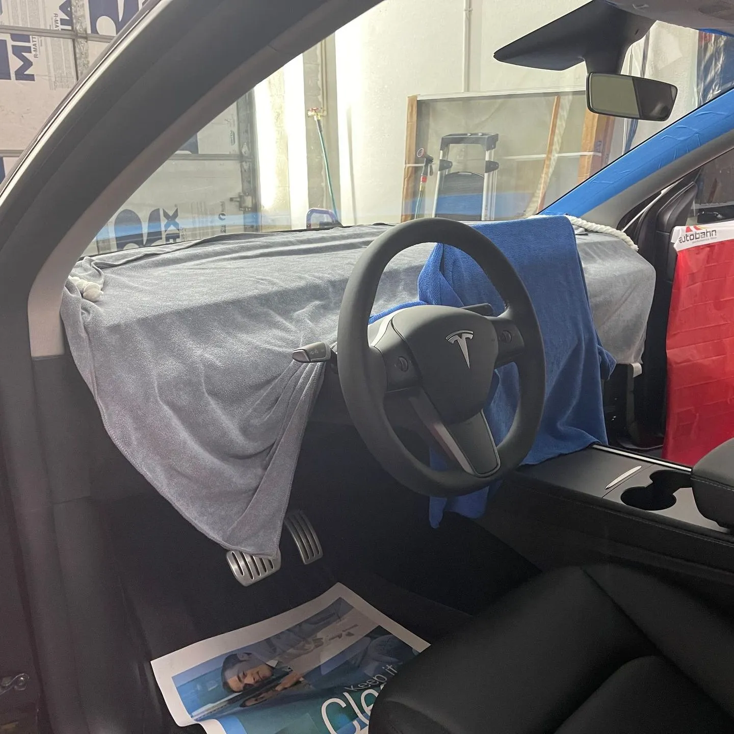 Tesla interior protected during professional window tint installation in San Diego