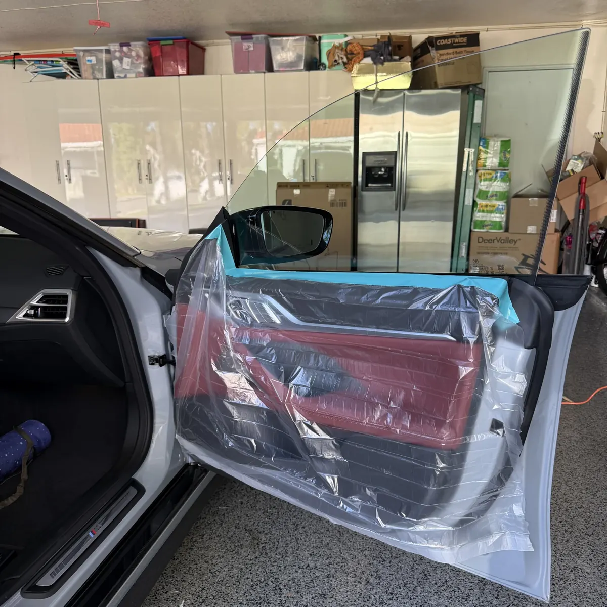 BMW i4 door panel covered for protection before window film application