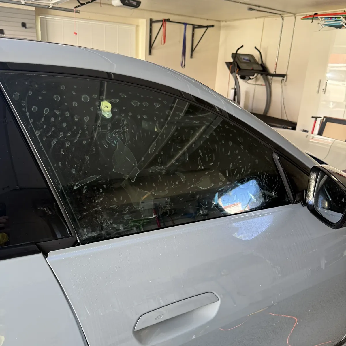 35% Nano Ceramic IR film being installed on a BMW i4 side window