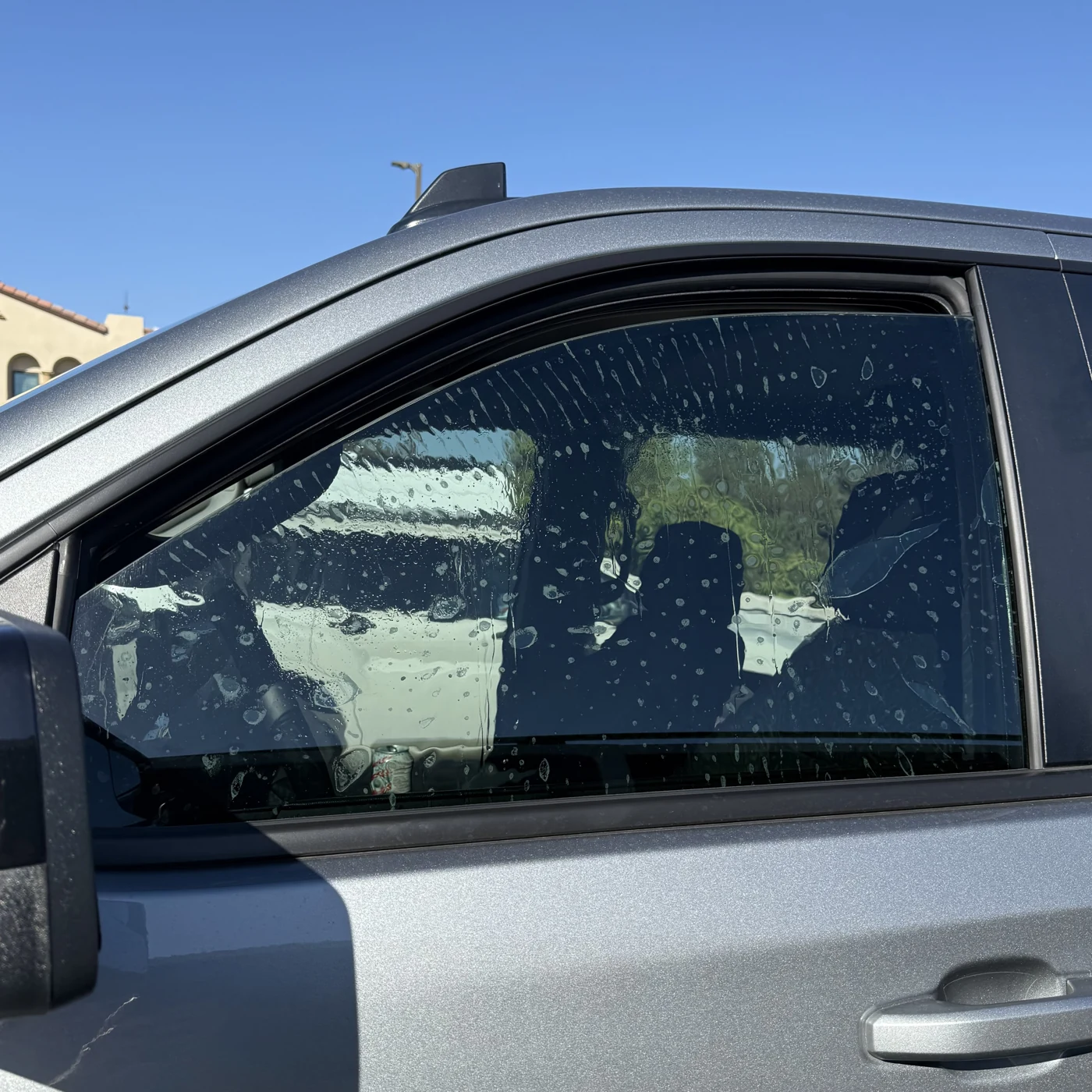 Nano Ceramic IR film being installed on a Chevrolet Silverado front door
