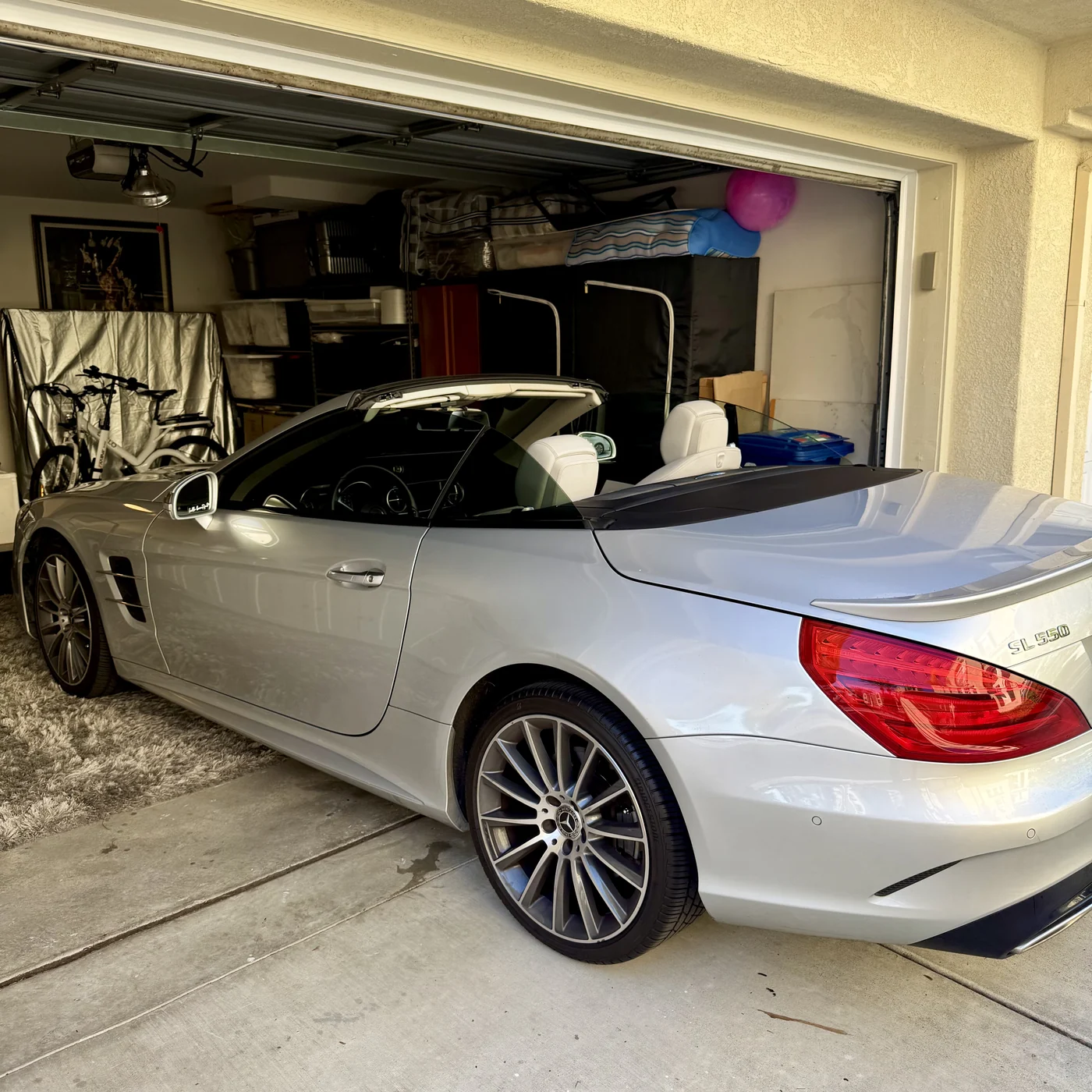 Mercedes-Benz SL550 with its retractable hardtop open during the Carmel Valley installation