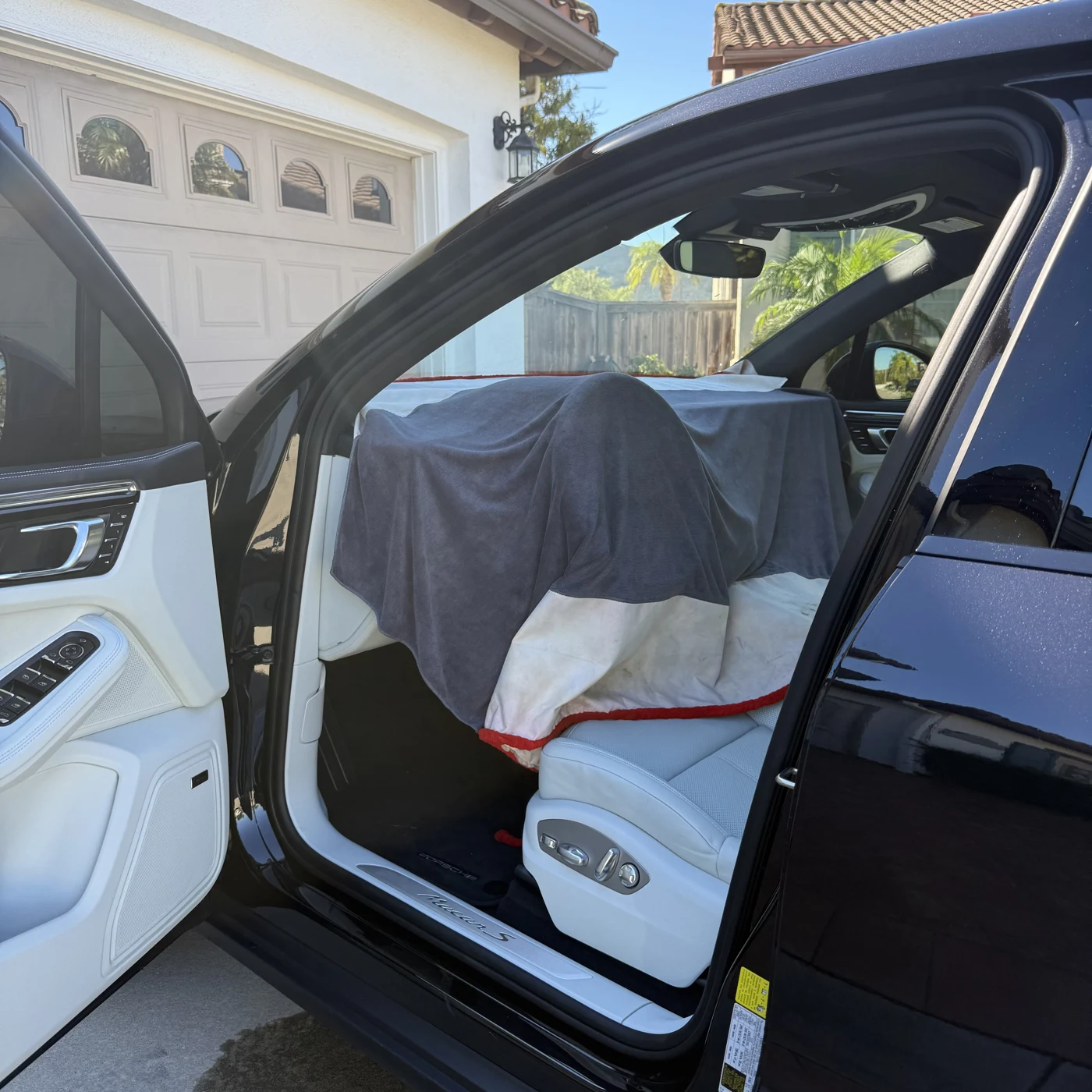 Dashboard and interior covered during Porsche Macan windshield tint installation