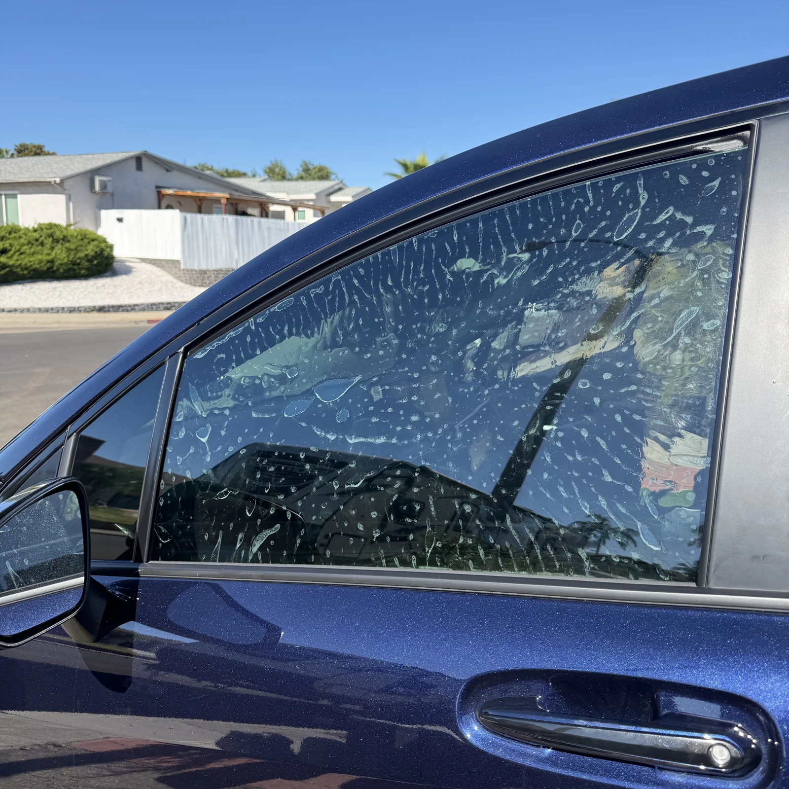 Nano Ceramic IR film with application solution on a Toyota Sienna front door window