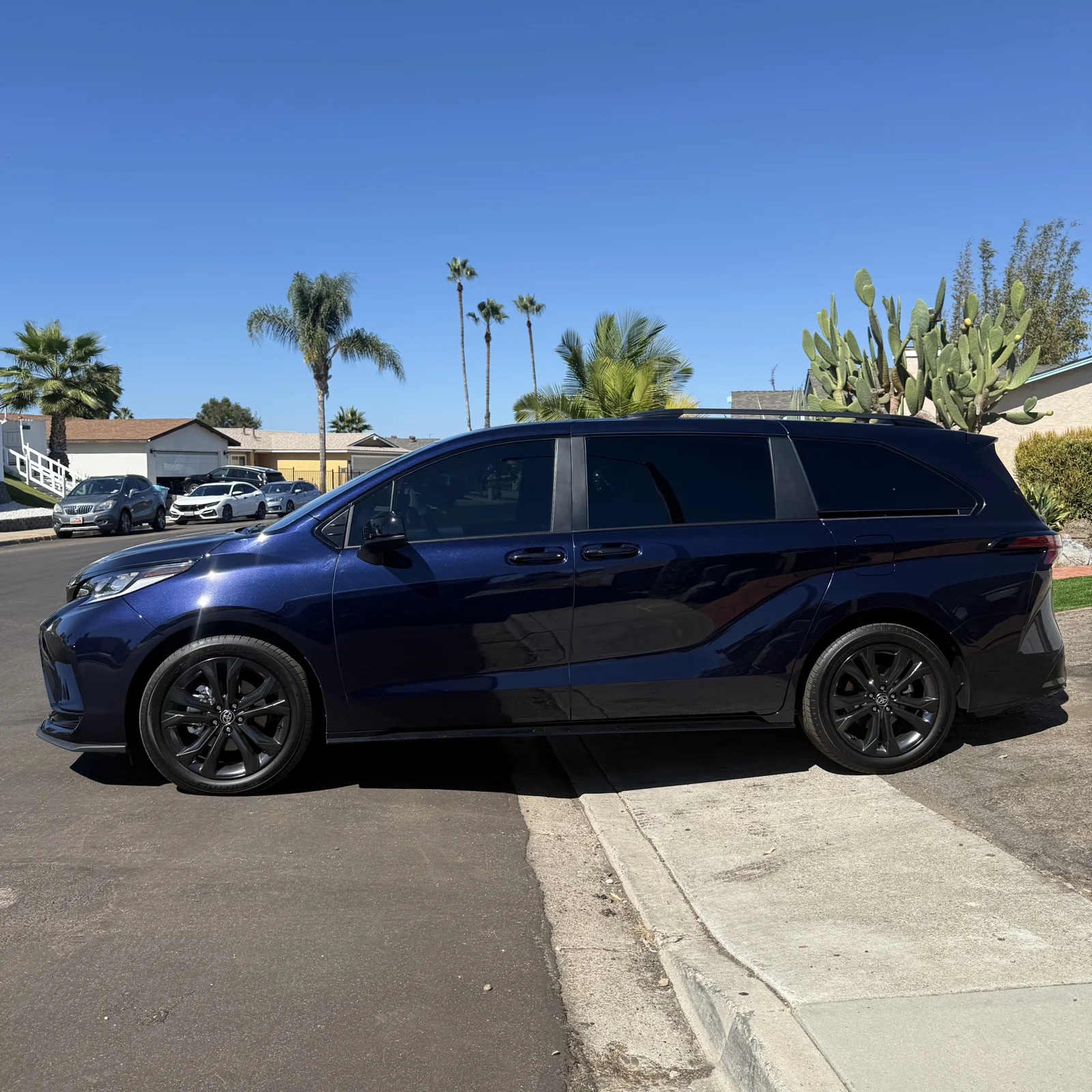Side view of a Toyota Sienna with 20% front-door film and 30% film over rear factory privacy glass