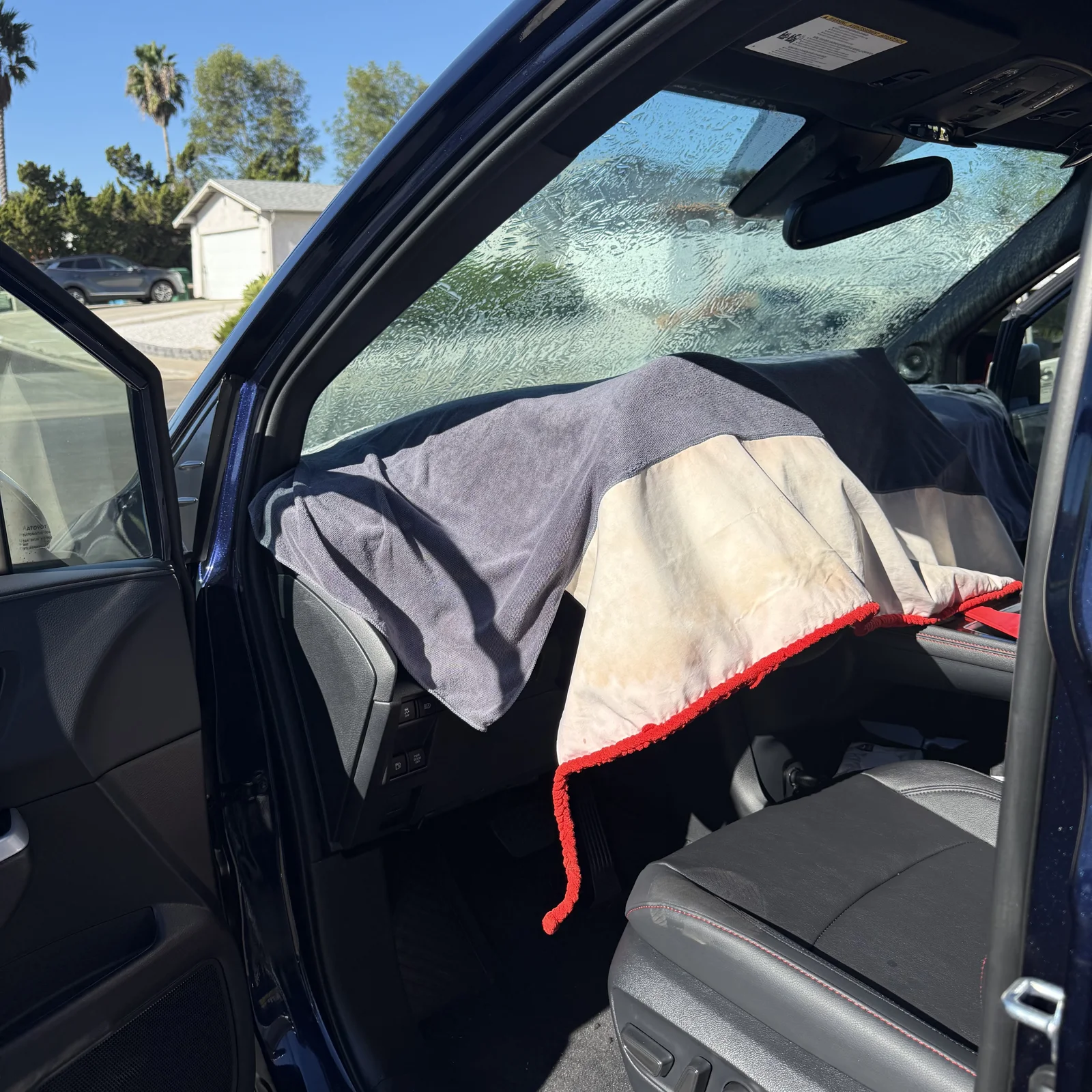 Dashboard protected during 70% Nano Ceramic IR windshield tint installation on a Toyota Sienna
